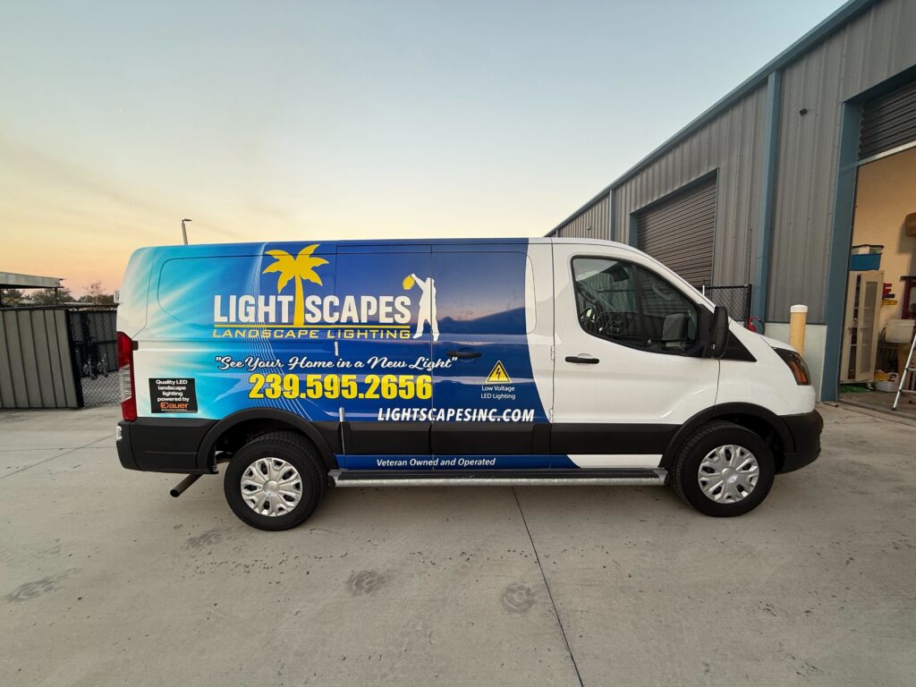 A van displaying the Lightscape logo prominently on its side, parked in a well-lit urban area